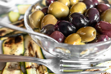 Olives into bowl