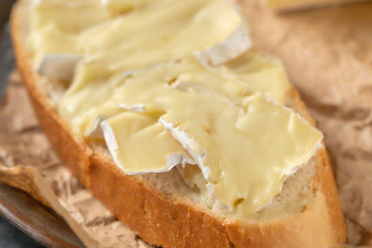 Macro photo with shallow depth of field of bread with brie cheese