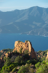Fototapeta na wymiar France. Corse. Corsica. vue du château, pic des calanches de Piana. La Méditerranée sous le soleil et un ciel bleu. view of the 