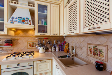 the interior of the kitchen in the style of Provence. The magnets on the hood, a vintage faucet for...