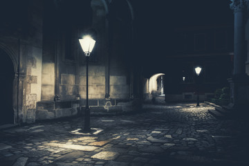 illuminated street at night. Old european city - 316408876