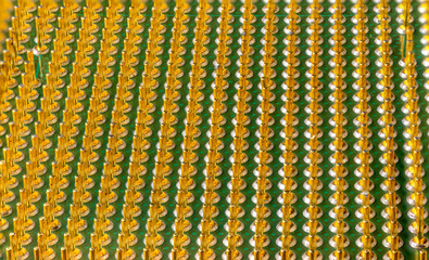 old computer processor with gilt legs, super macro photo side view