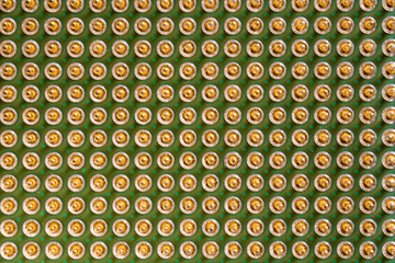 old computer processor with gold-plated legs, on a green board, top view, super macro photo