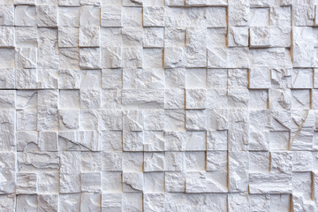 The texture of the stone. White brick. Decorative wall in the interior of the apartment.