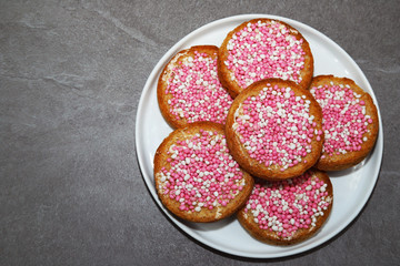 Rusk with pink and white anise seeds.  Traditional Dutch treat to celebrate the birth of baby girl.
