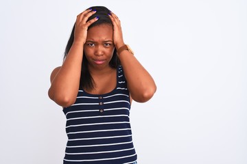 Beautiful young african american woman wearing summer t-shirt over isolated background suffering from headache desperate and stressed because pain and migraine. Hands on head.