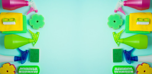 Spring cleaning concept with supplies over blue background. Top view from above