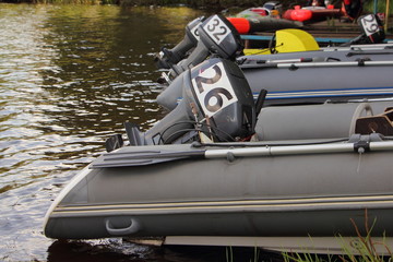 Inflatable motor boats racing, outboard motors with competition numbers on hoods
