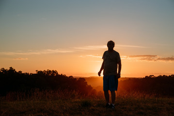 Fototapeta premium man in nature at sunset