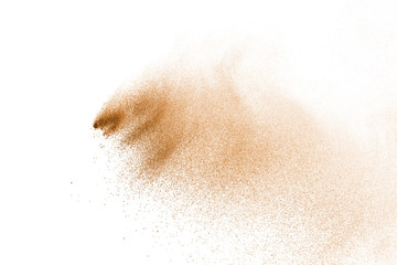 Brown powder explosion isolated on white background.