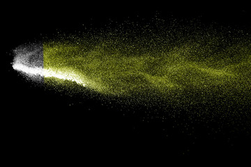 Yellow powder explosion on black background.