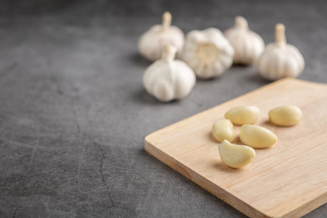 Garlic on the black table. High angle view