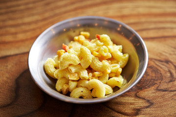 Macaroni and mayonnaise salad on table 
