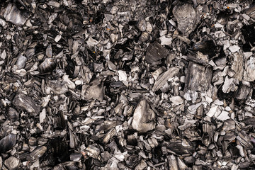 black burnt embers close up background texture