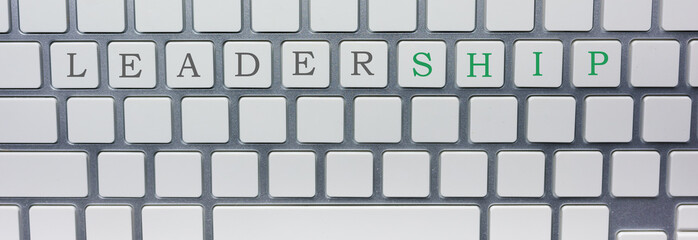 Silver keyboard with words: Leadership