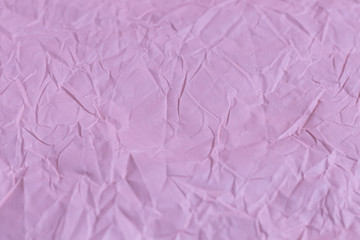 Background from pink crumpled wrapping paper. Congratulatory banner, card.