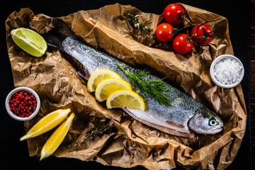 Fresh raw trout and vegetables