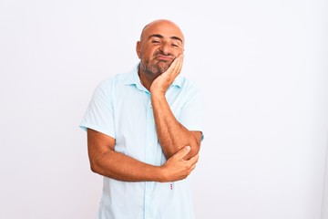 Middle age handsome man wearing casual shirt standing over isolated white background thinking looking tired and bored with depression problems with crossed arms.
