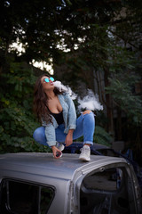 Vaping. Young beautiful woman vaping . Vapor concept.