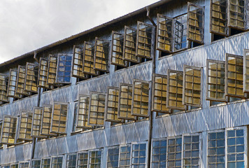 Windows on the facade of a tea factory in Munnar, India