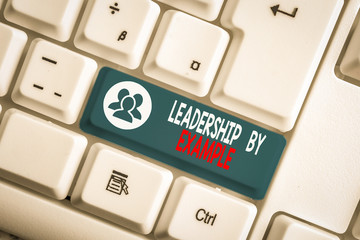 Writing note showing Leadership By Example. Business concept for Becoming role model for showing...