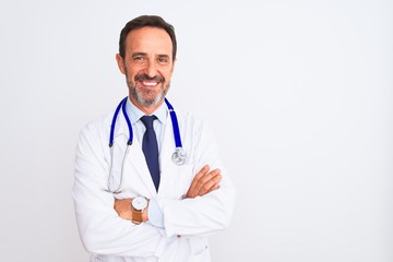 Middle age doctor man wearing coat and stethoscope standing over isolated white background happy face smiling with crossed arms looking at the camera. Positive person.