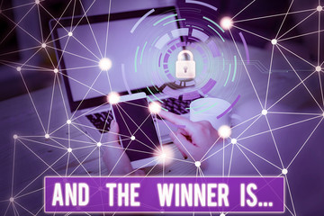 Conceptual hand writing showing And The Winner Is. Concept meaning announcing a demonstrating or...