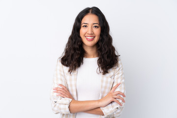 Mixed race woman over isolated white background keeping the arms crossed in frontal position