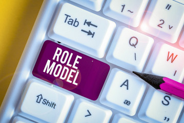 Word writing text Role Model. Business photo showcasing a demonstrating looked to by others as an...