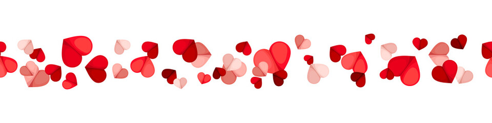 Vector Valentine’s day horizontal seamless background with red and pink hearts on a white background.