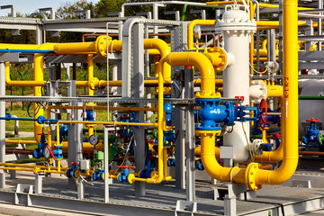 Gas industry. Pipeline and valves system at a gas production and processing plant - obrazy, fototapety, plakaty