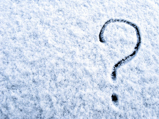 Question mark on the first fluffy snow. Winter. Toned. Copy space.