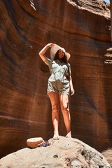 Young beauitufl hiker woman trekking natural orange mountain on summer holidays