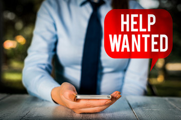 Writing note showing Help Wanted. Business concept for An ad in the paper an employer places to...