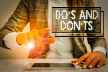 Writing note showing Do S And Don tS. Business concept for Rules or customs concerning some...