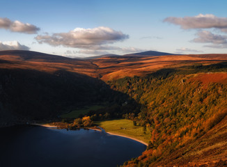 Spectacular view of Luggala valley, Lough Tay and Wicklow mountains in sunset tones, Ireland