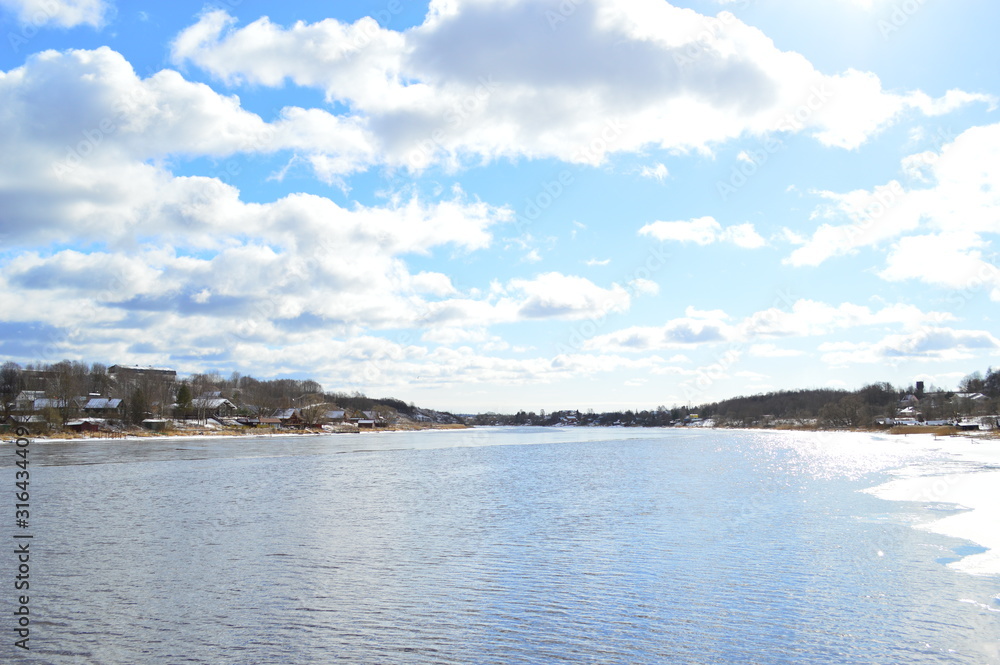 Poster view of beach with blue sky and clouds