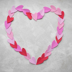 Heart made of pastel petal hearts on a light background. Valentine's Day, World Women's Day, Mother's Day.