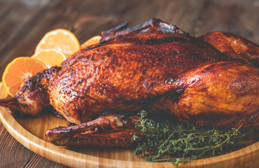 Baked duck on wooden tray
