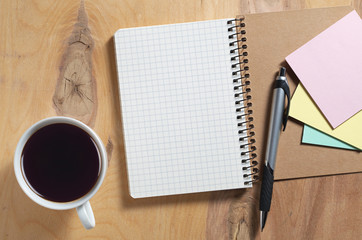 Notebook, paper stickers and coffee