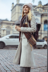 Fototapeta premium Young cheerful lady outdoors and indoors