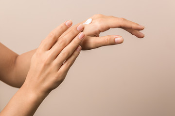 healthy hands of a young woman applying the cream. skincare concept beauty photoshoot - obrazy, fototapety, plakaty