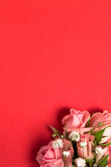 Bouquet of pink roses on a bright red background. Top view, copy space, close up, birthday, gift, 8 march, 14 february