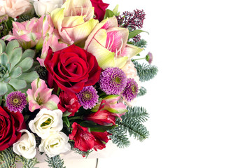 Obraz na płótnie Canvas floral fresh arrangement of bright flowers in a hat box copy space white background