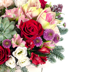 floral fresh arrangement of bright flowers in a hat box copy space white background