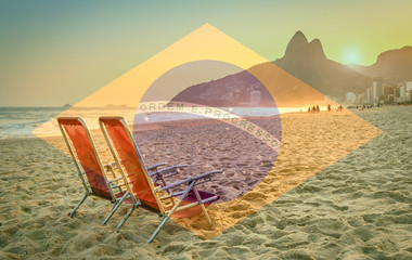Beach deck chair against a backdrop of Two Brothers Mountain in Rio de Janeiro, Brazil