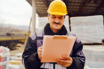 Portrait of caucasian senior man construction worker general laborer building contractor wearing...