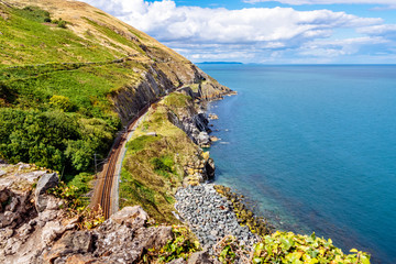 View from Cliff Walk Bray to Greystones with beautiful coastline, cliffs, sea and train tracks,...