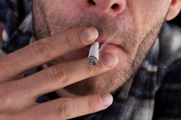 a man smoking cigarette