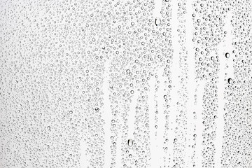 white isolated background water drops on the glass / wet window glass with splashes and drops of water and lime, texture autumn background